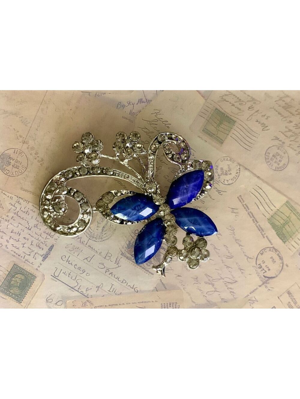 Vintage Sparkling Blue Floral Brooch with Rhinestones and Elegant Design
